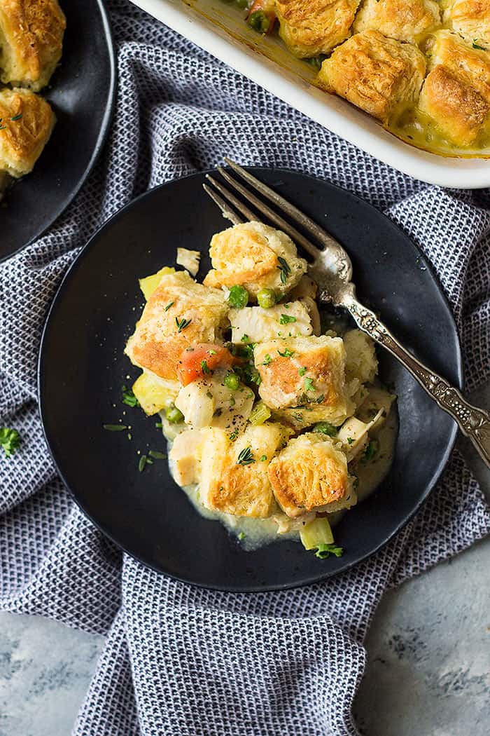 Plate and fork with serving of chicken pot pie with biscuits. 
