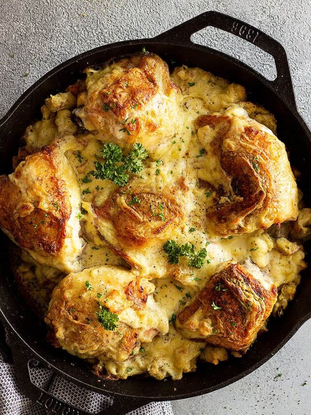 Overhead view of casserole in a cast iron pan fresh from the oven. Garnished with parsley.