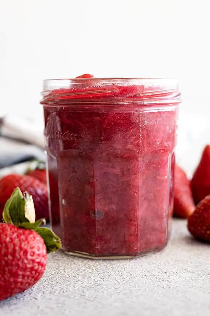 Strawberry rhubarb sauce in a jar ready to be used for all types of desserts or even at breakfast.