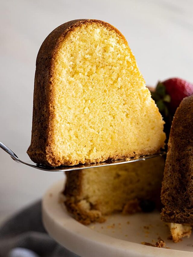 A slice of cake being cut from the cake.