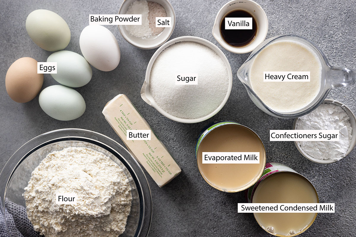 Ingredients: eggs, baking powder, salt, vanilla, sugar, butter, flour, heavy cream, evaporated milk, sweetened condensed milk, and confectioners sugar.