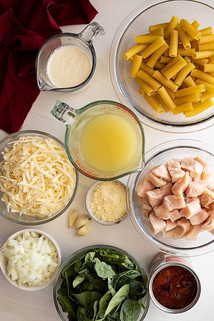 Overhead view of ingredients needed to make chicken florentine pasta.