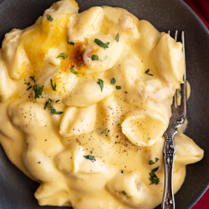 Overhead view of a plate of deliciously indulgent creamy baked mac and cheese.