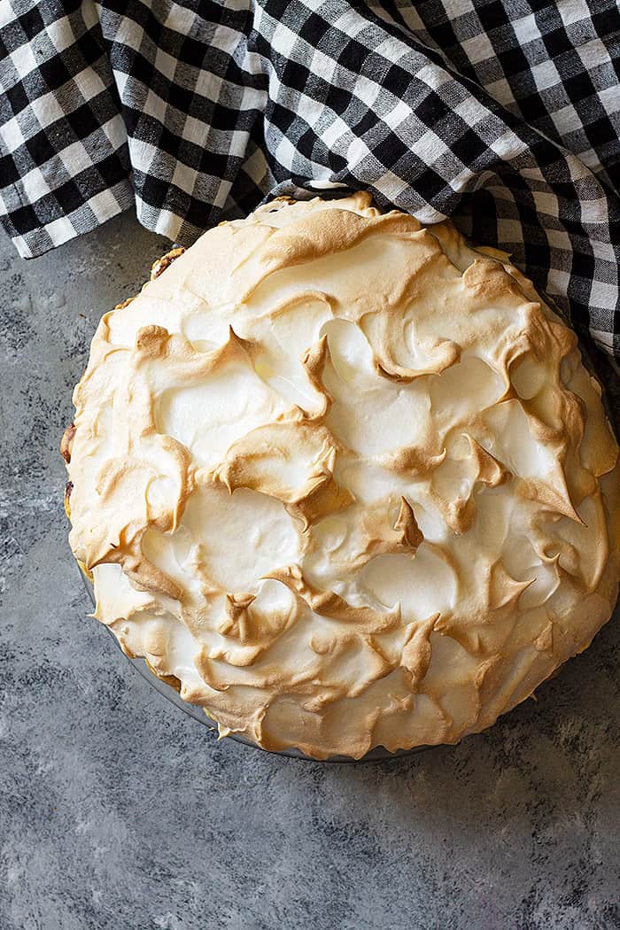 Top down view of chocolate meringue pie. Can see all the pretty swirls of meringue. 