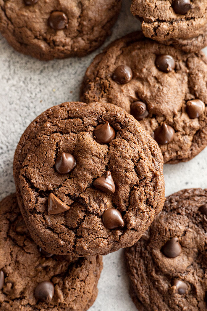 Several cookies stacked on top of each other and around the frame of the photo. 