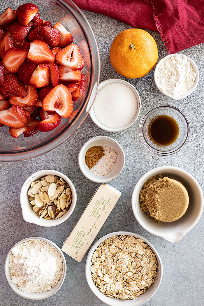 Overhead view of all the ingredients needed to make a strawberry crisp.
