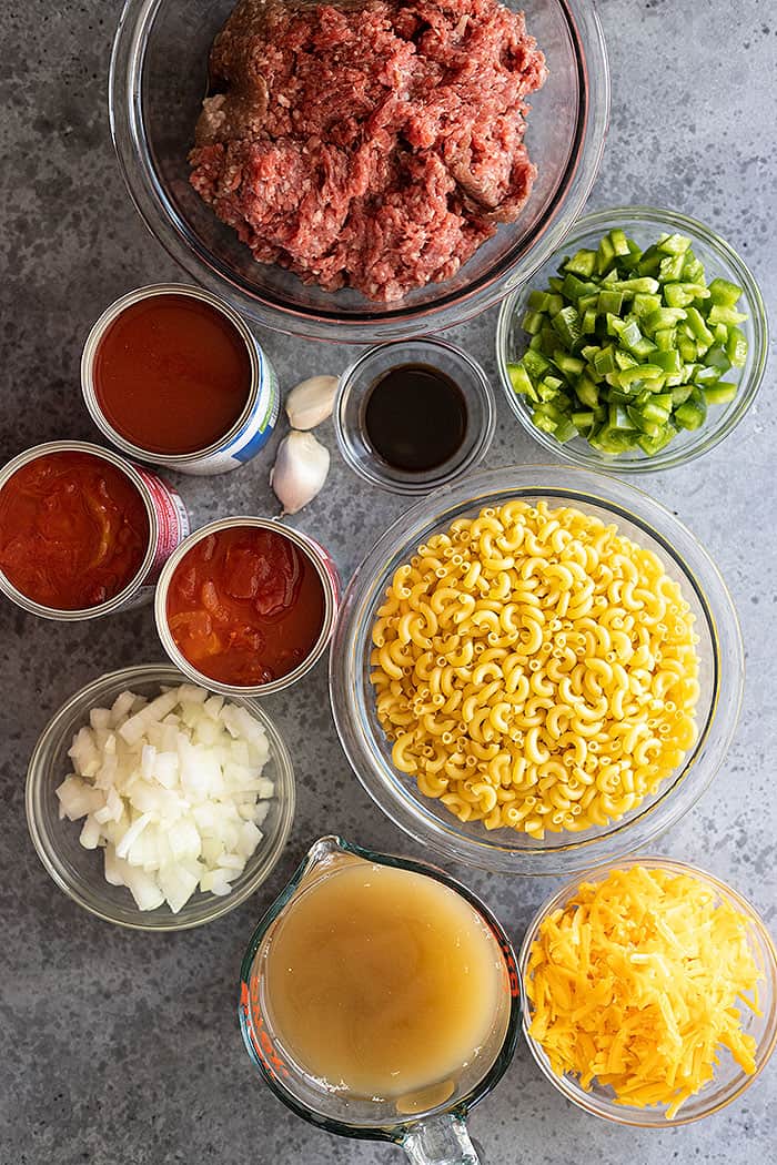 All the yummy ingredients need to make this classic dish like elbow noodles, ground beef, canned tomatoes, and onion.