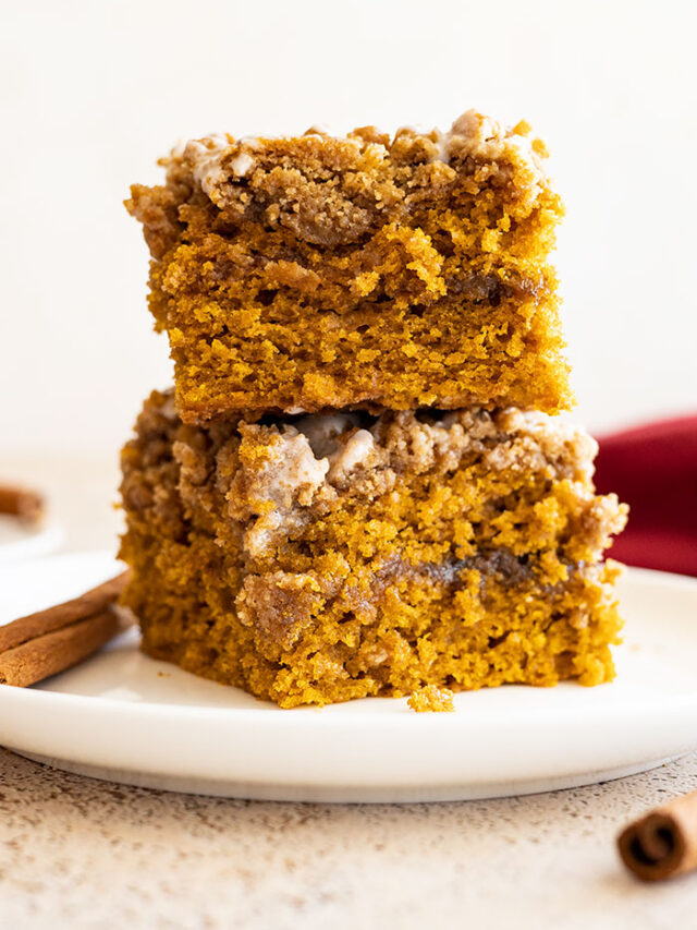 Two slices of pumpkin coffee cake stacked on top of each other.