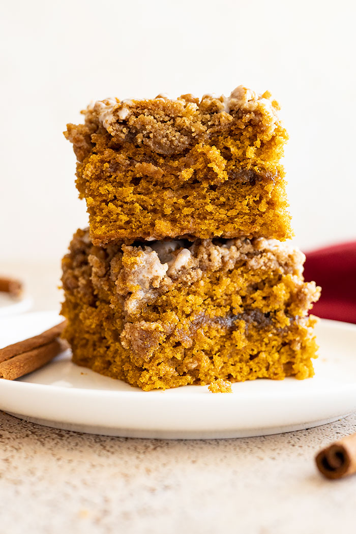 Two slices of pumpkin coffee cake stacked on top of each other.