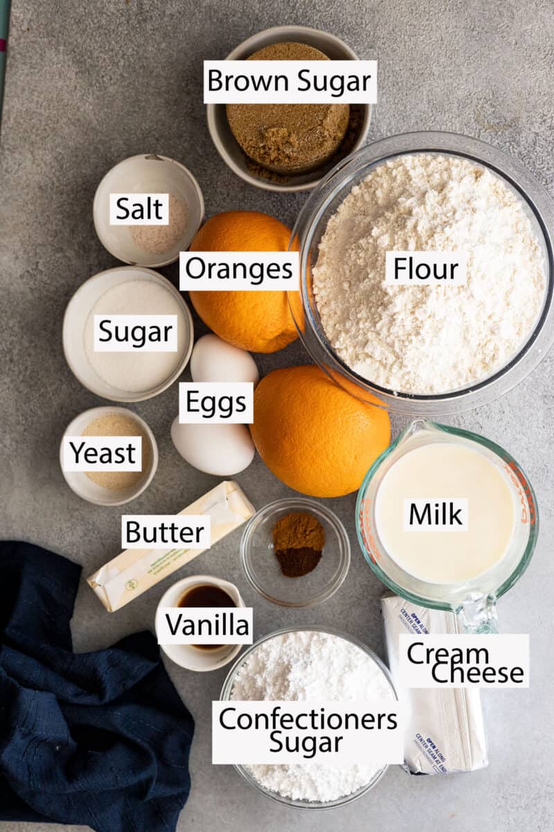 Ingredients: flour, sugars, oranges, eggs, salt, yeast, milk, butter, vanilla, cinnamon, clove, cream cheese, confectioners sugar.