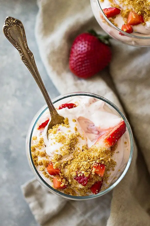 Spoon inside strawberry cheesecake salad recipe.