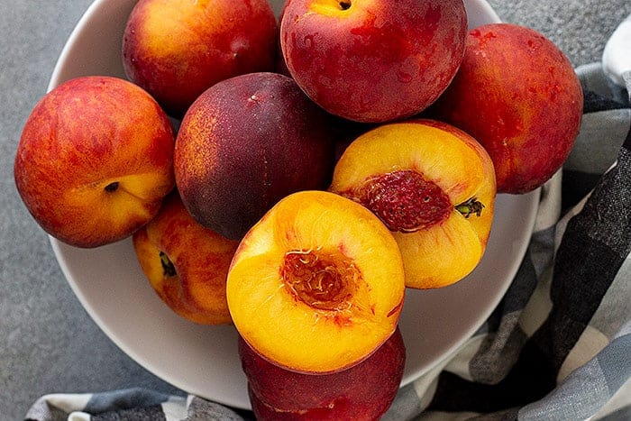 A bowl of fresh peaches for this peach salsa recipe.