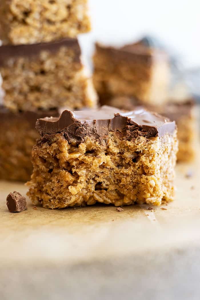 Close up of this scotcheroo recipe. Layers of cereal and chocolate are visible.