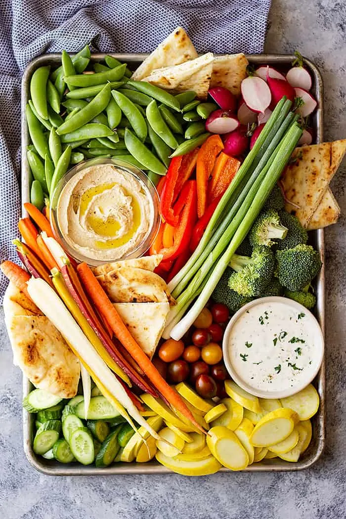 Overhead view of a beautiful vegetable tray complete with homemade ranch