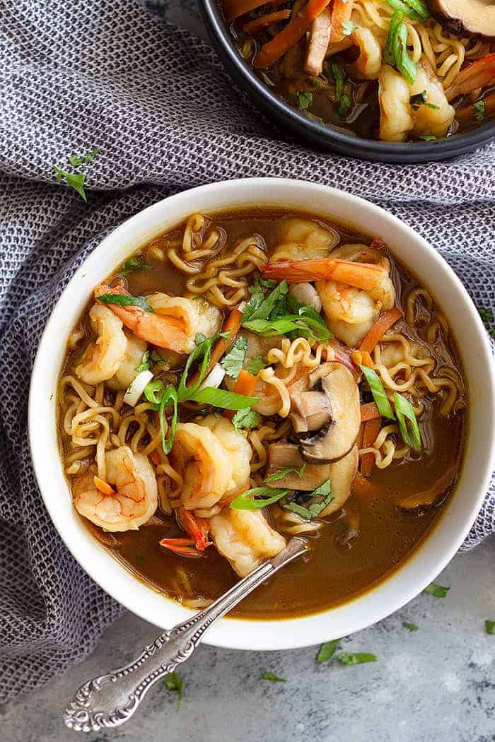 top down view of seafood ramen recipe in a white bowl