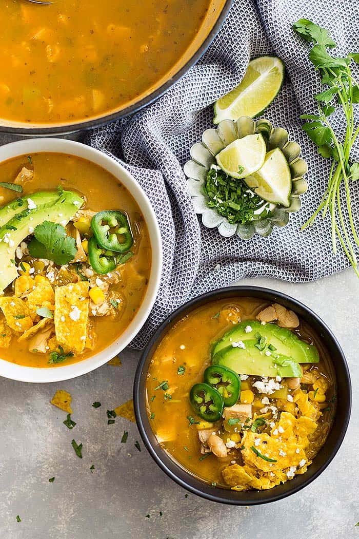 overhead: two bowls of white chicken chili with rotisserie chicken