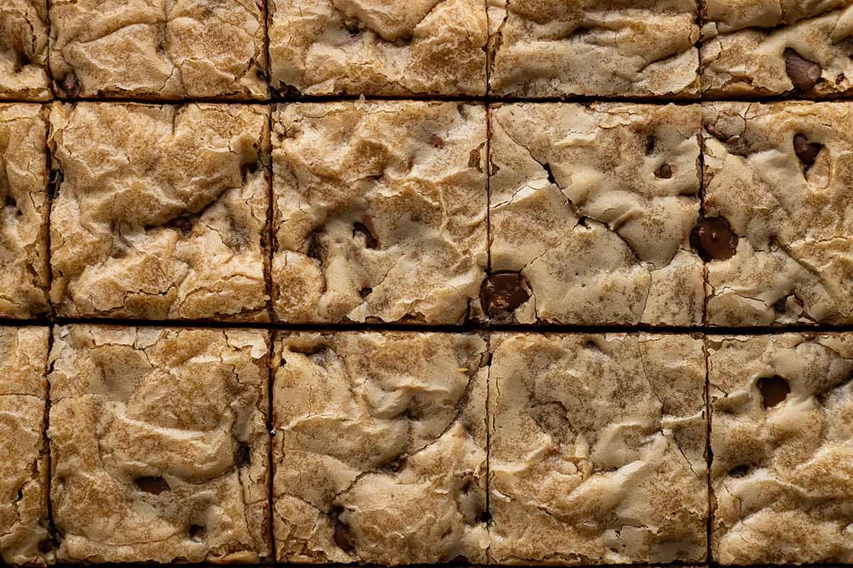 Overhead view of chocolate chip cookie bars cut into bars. 