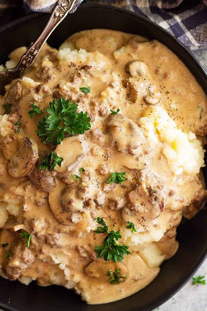 overhead closeup: saucy beef stroganoff with hamburger over mashed potatoes