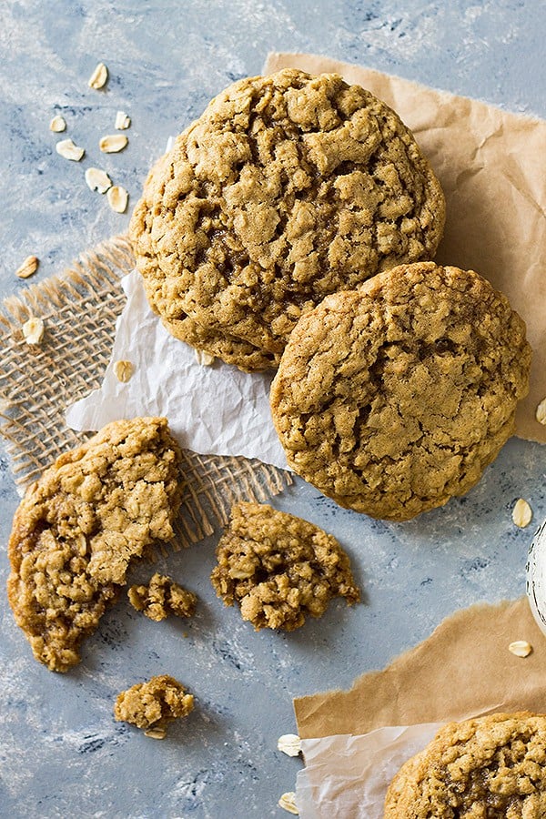 overhead: three chewy oatmeal cookie recipe cookies with one broken apart