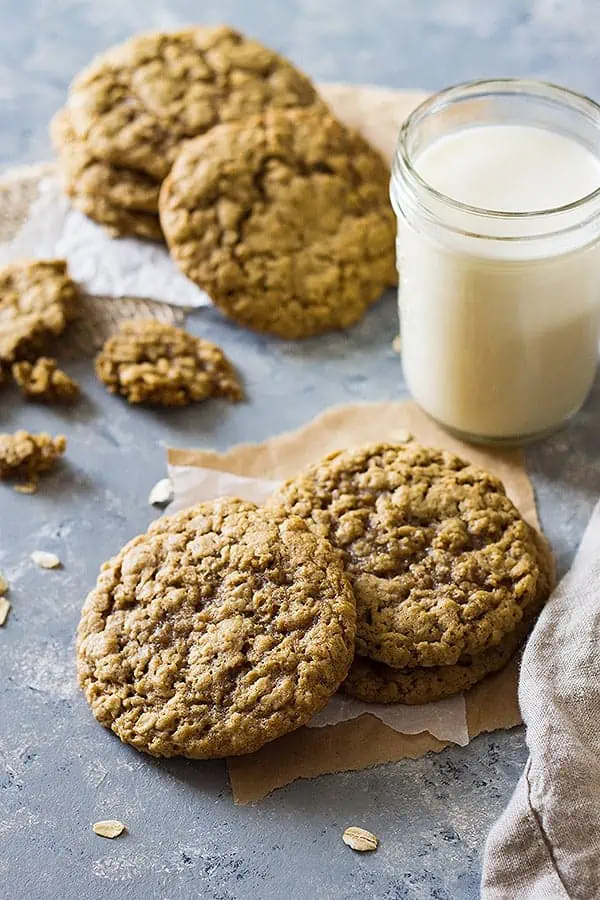 three soft oatmeal cookie recipe cookies with a glass of milk