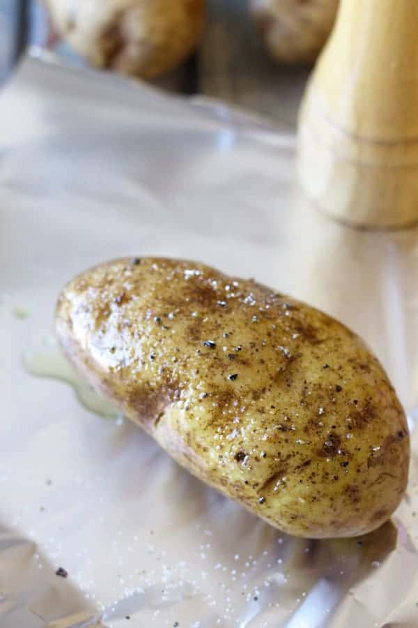 baked potato smothered in olive oil and sprinkled with salt