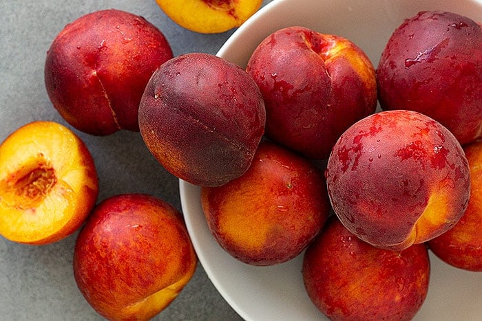 overhead: a bunch of fresh peaches for this peach ice cream recipe