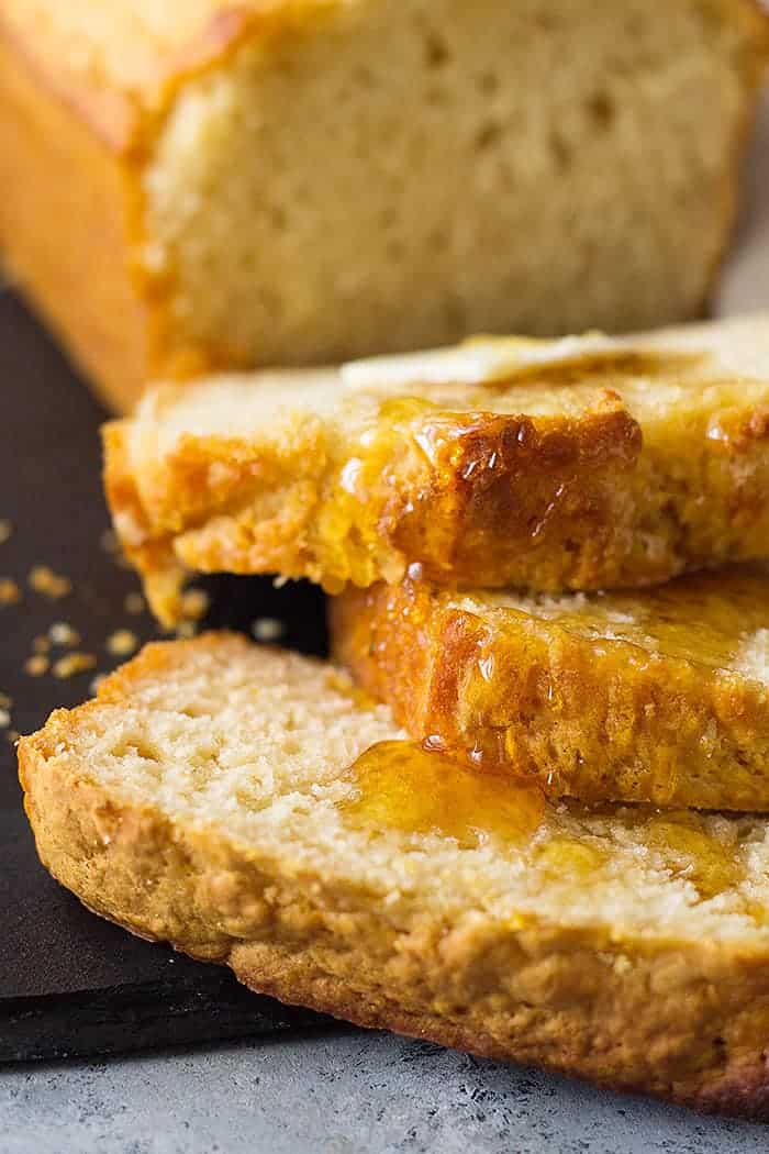 closeup: slices of beer bread with honey and butter on top