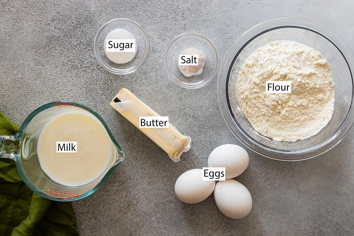 Ingredients: flour, eggs, milk, sugar, and salt. Butter for the pan. 