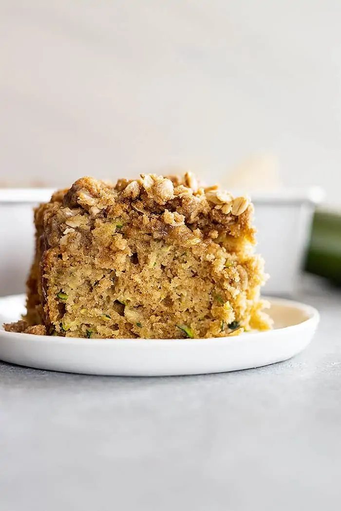 side view: a large serving of zucchini cake with lots of streusel topping