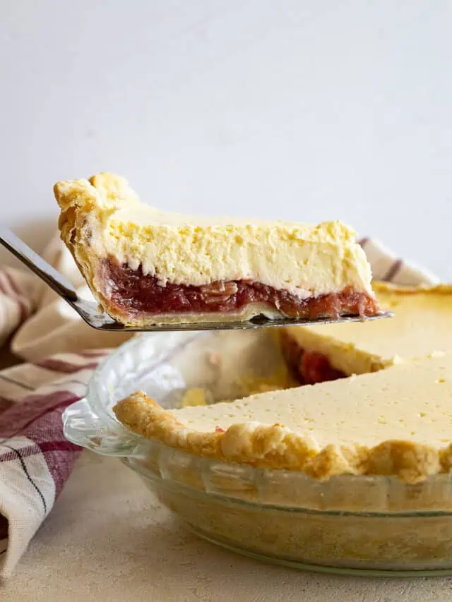 A piece of pie being taken out of the pie.