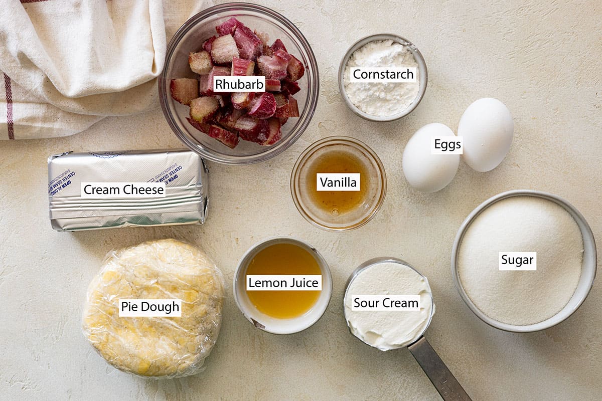Ingredients: rhubarb, cornstarch, eggs, vanilla, sugar, sour cream, lemon juice, cream cheese, pie dough. 