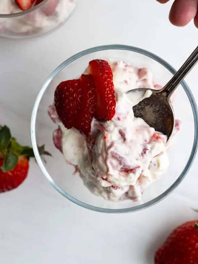 Overhead view of strawberry rhubarb fool in a glass serving bowl.