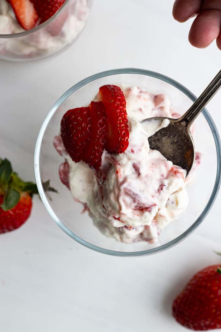 Overhead view of strawberry rhubarb fool in a glass serving bowl.