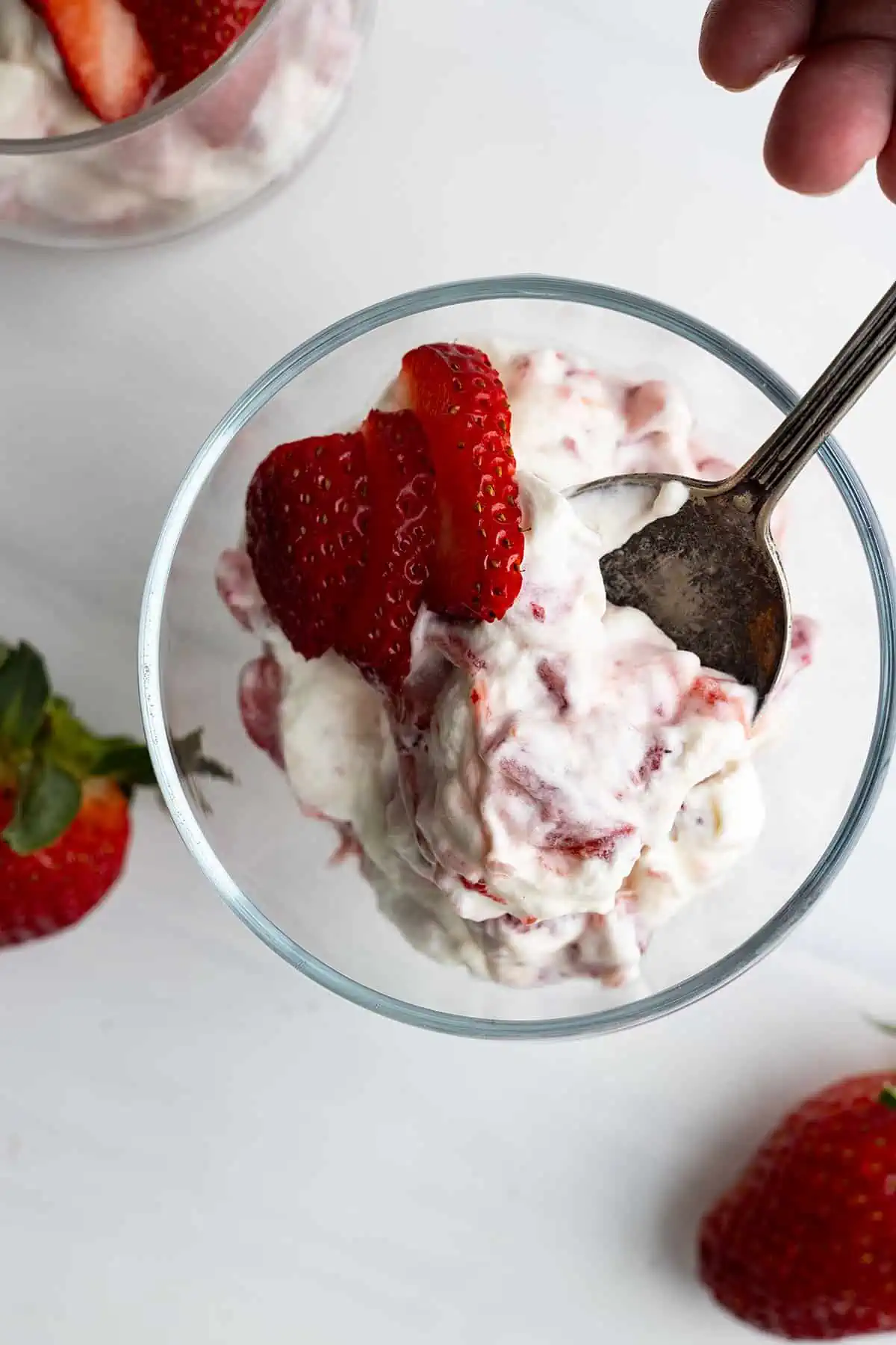 Overhead view of strawberry rhubarb fool in a glass serving bowl. 