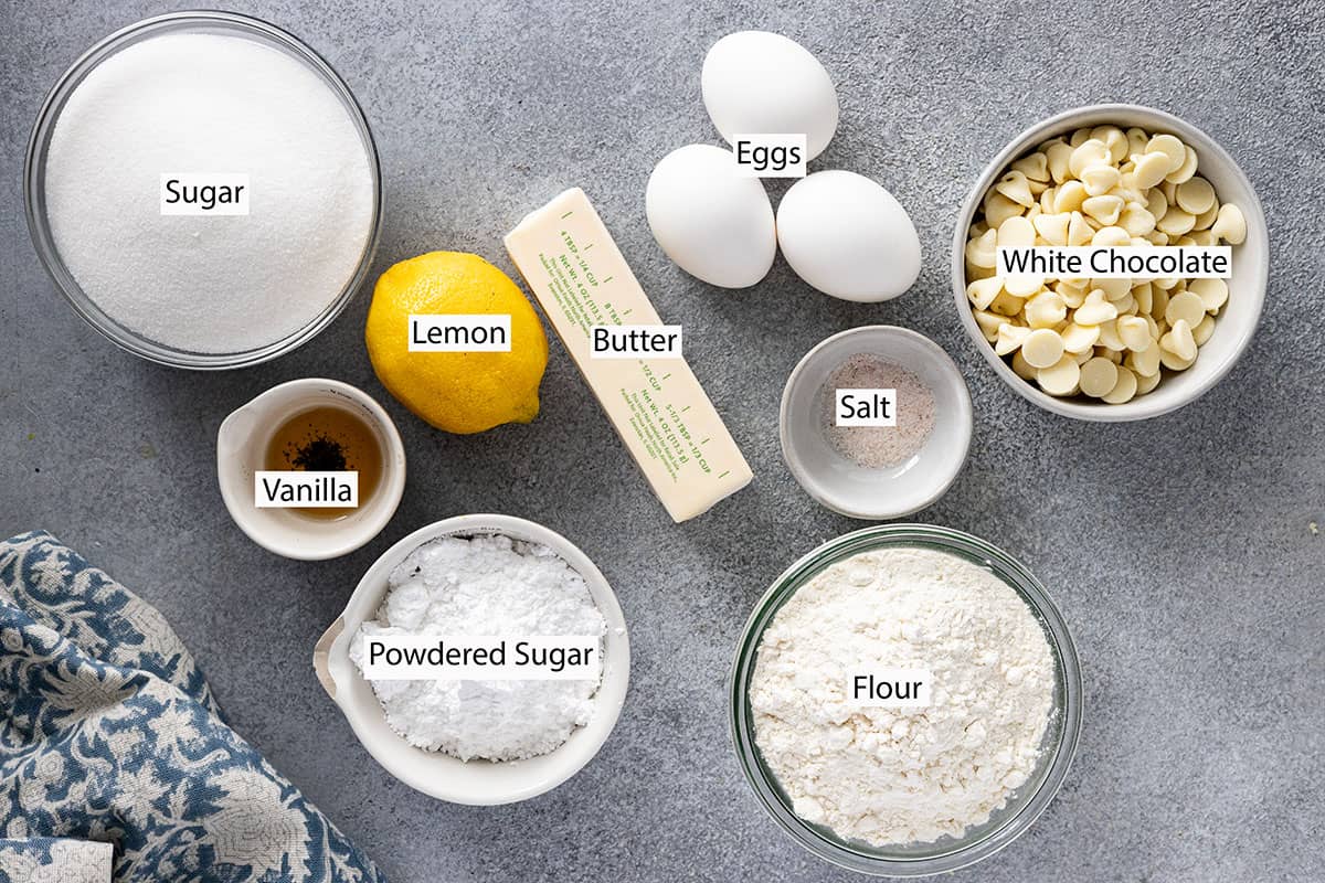 Ingredients: sugar, lemon, vanilla, powdered sugar, butter, eggs, flour, salt, and white chocolate chips.