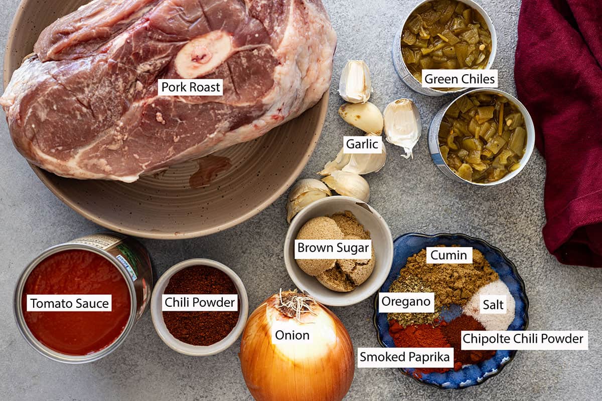 Ingredients: pork roast, tomato sauce, chili powder, onion, brown sugar, garlic, cumin, oregano, smoked paprika, chipolte, and green chiles. 