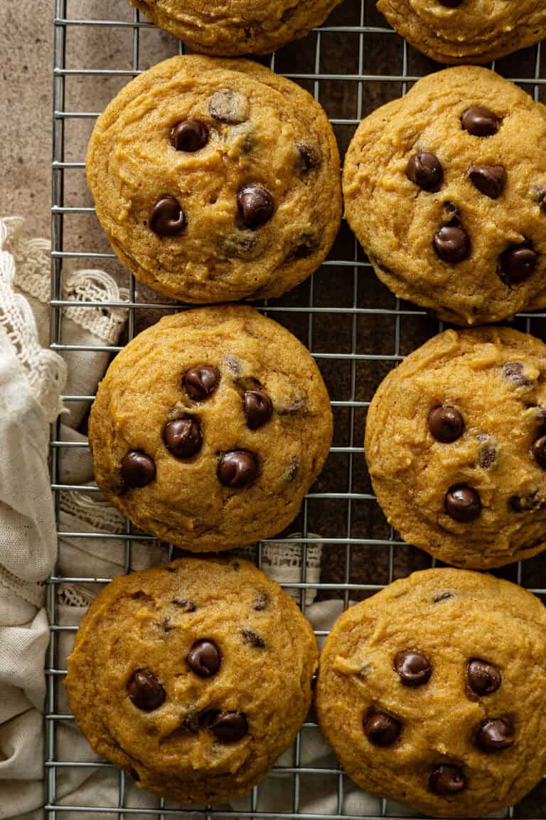 Pumpkin chocolate chip cookies cooling on a cooling rack.