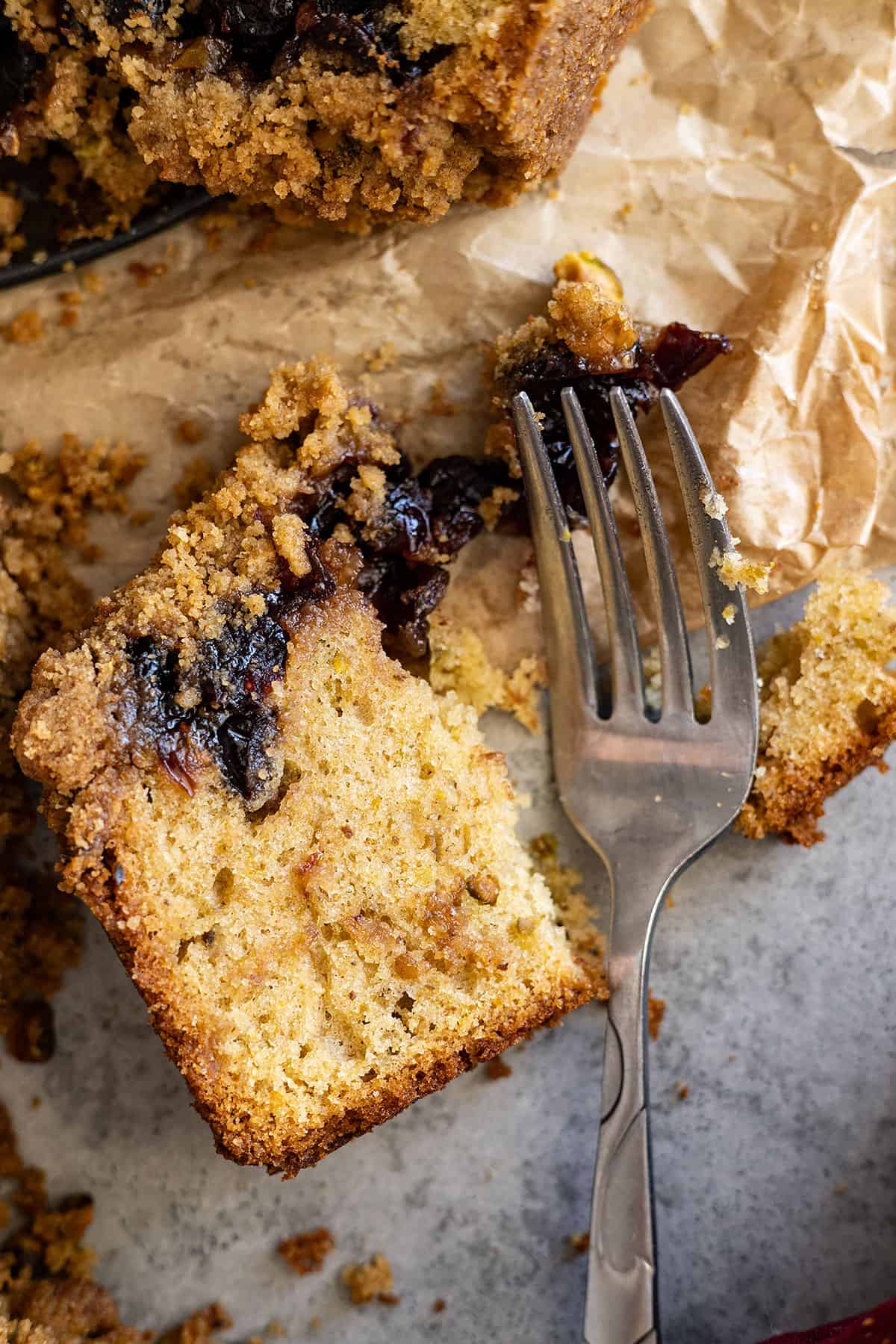 Fork cutting into a piece of cake. 