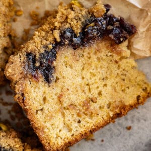 Overhead view of cake slice showing the layer of cranberries.