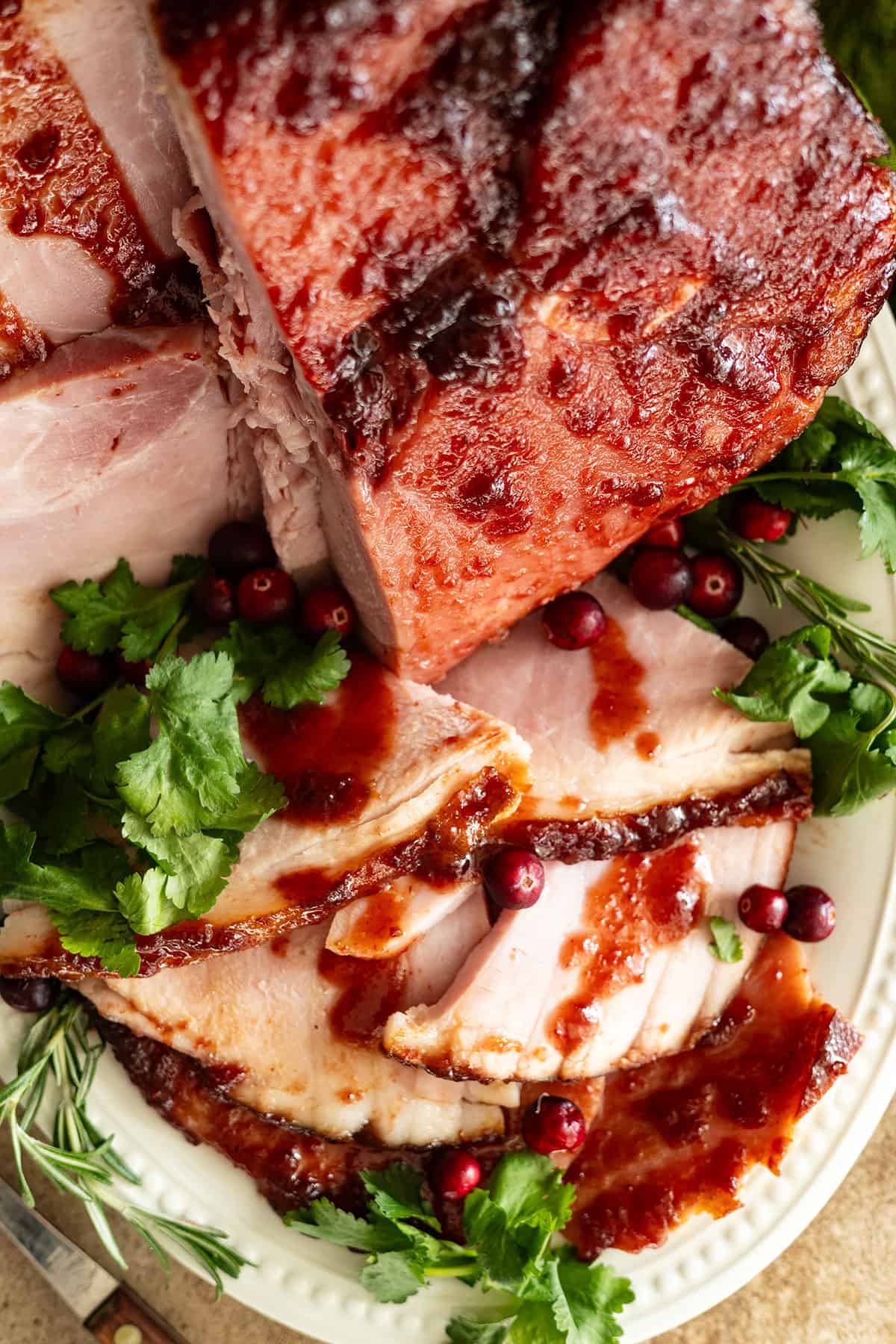 close up of sliced ham on a white plate. 