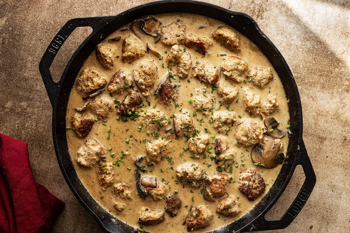 Finished pan of turkey meatballs in creamy mushroom gravy. 