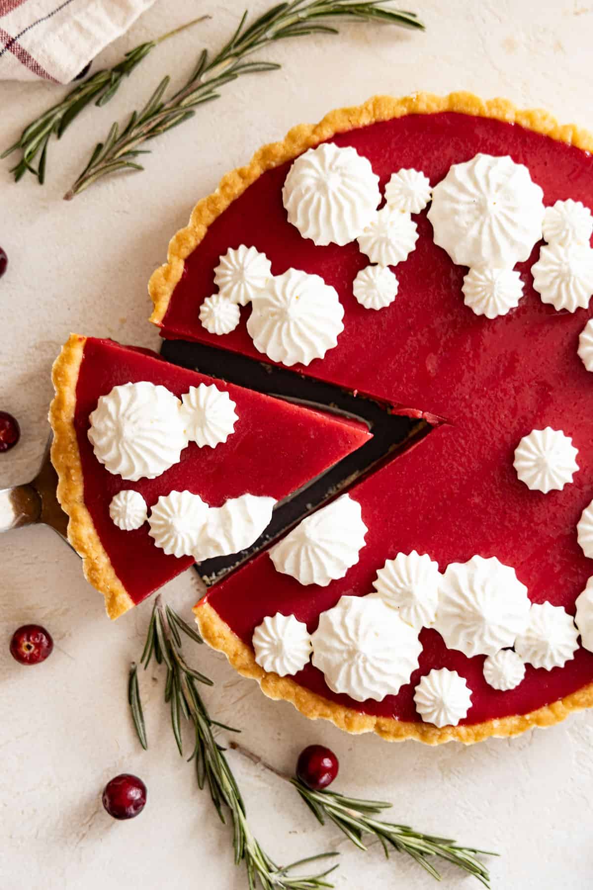 Overhead view of a slice being taken out of the tart. 