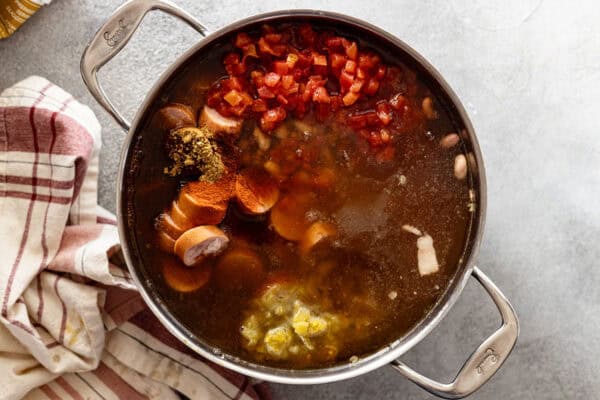 picture of adding all the remaining ingredients to the soup pot.