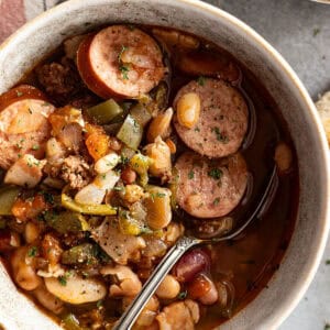 close up of soup in a bowl with spoon. napkin off to the side.