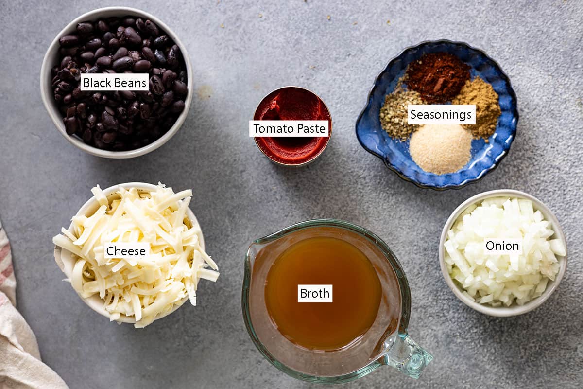 Ingredients: black beans, tomato paste, seasonings, cheese, broth, onion.