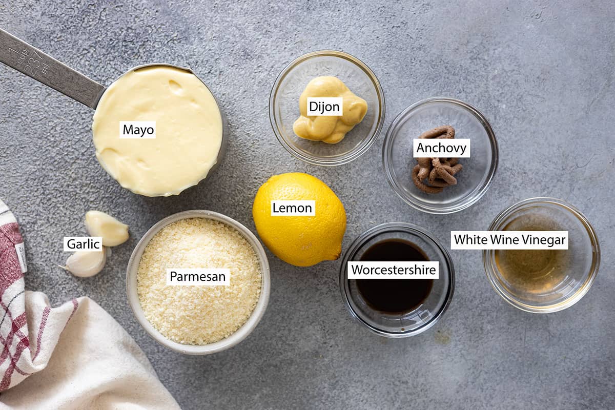 Ingredients: mayonnaise, garlic, parmesan, lemon, dijon, worcestershire, anchovy paste, and white wine vinegar.