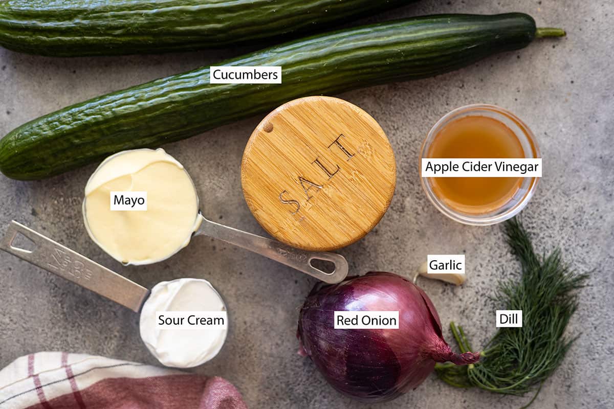 Ingredients: cucumbers, mayo, sour cream, salt, apple cider vinegar, red onion, garlic, and dill.