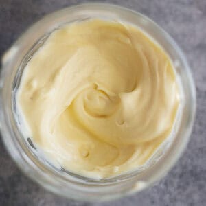 Overhead picture of homemade mayonnaise in a jar.