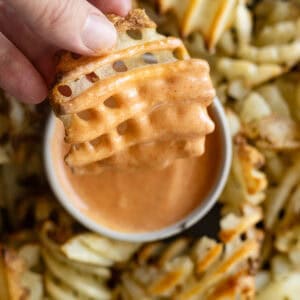 Overhead picture of fry dipping in fry sauce.