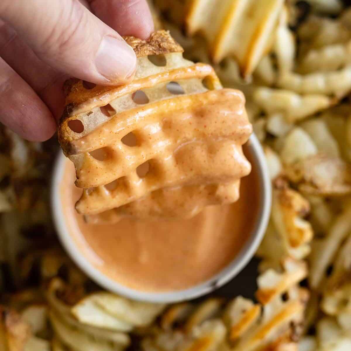 Overhead picture of fry dipping in fry sauce.